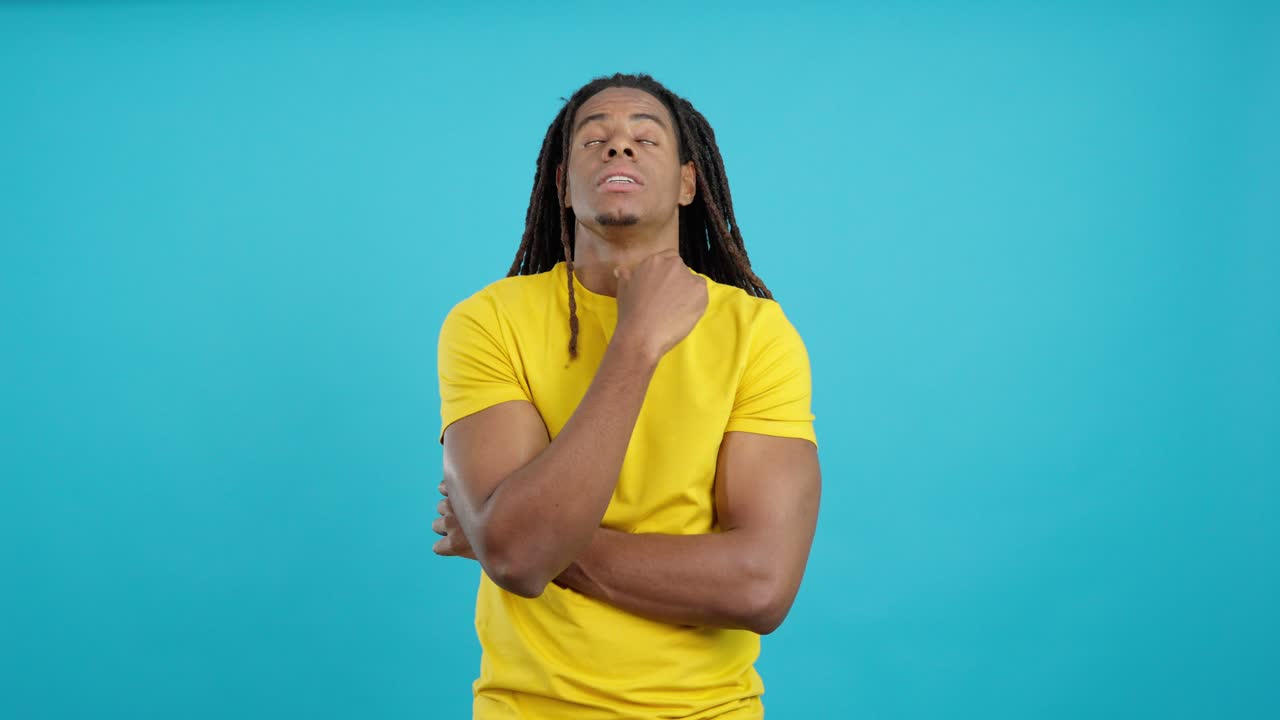 Man with dreadlocks thinking