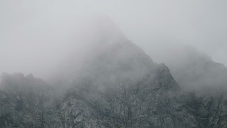 Huge-granite-walls-with-clouds-passing-by