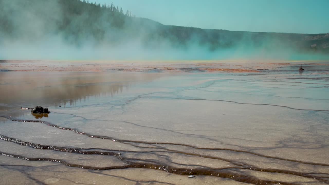 Steam coming off the boiling super heated waters of the Grand Prismatic Hot Spring