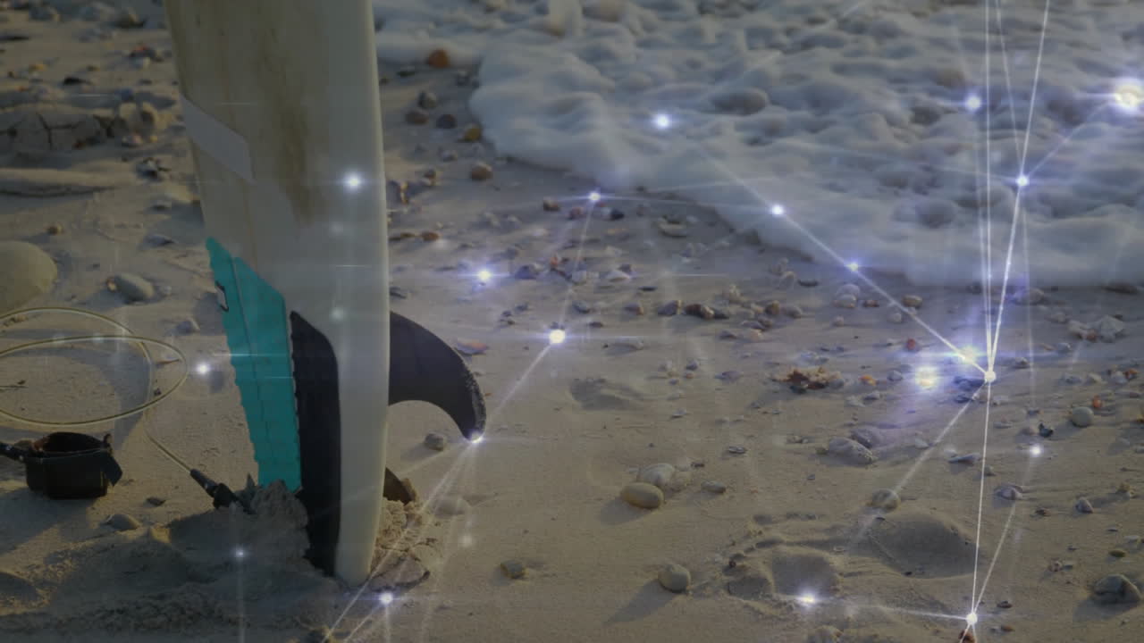 Surfboard tail showing 3D network overlay connecting glowing nodes across wet sand and waves