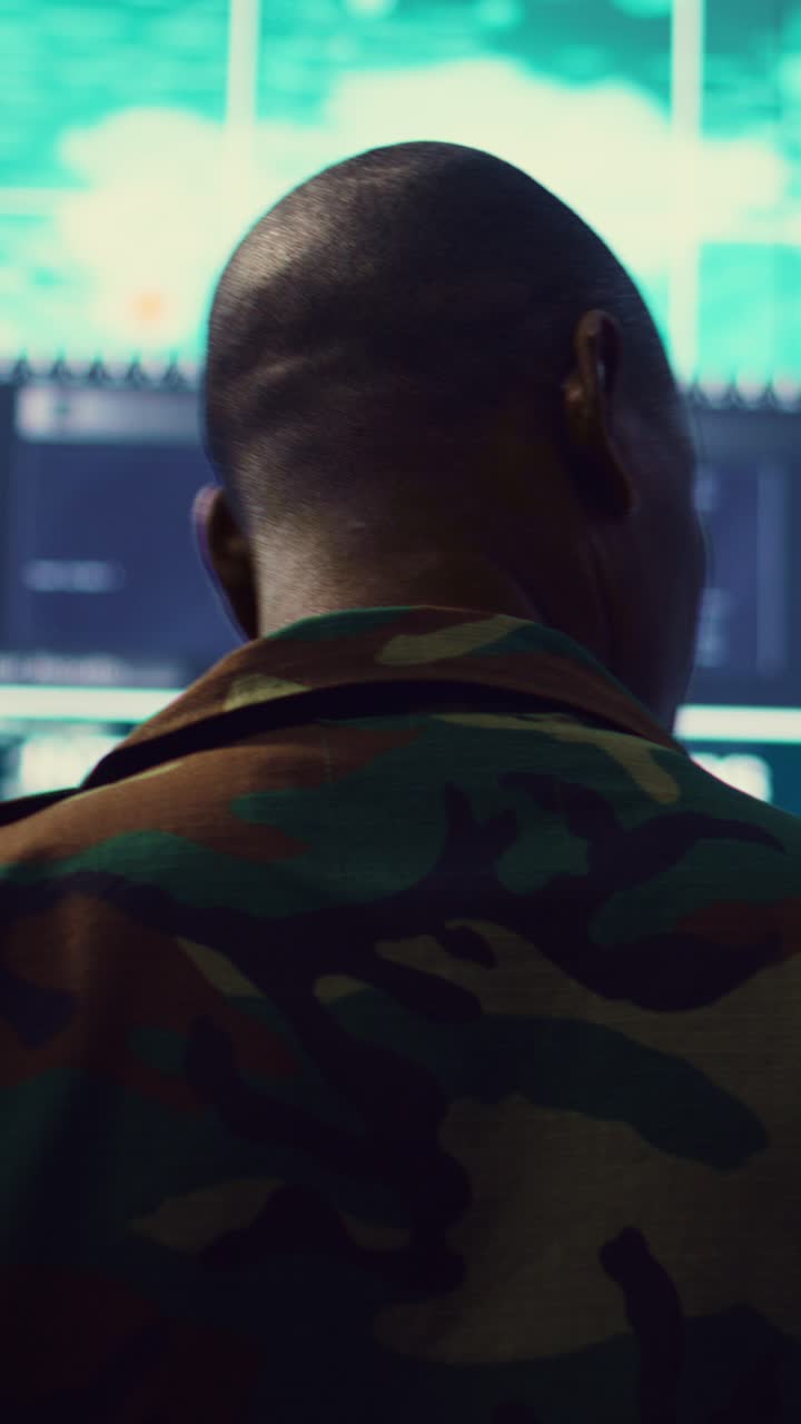Soldier Monitoring Data on Large Screens in Control Room