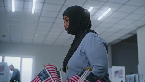 woman voting at a polling station