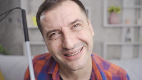 Close-up-of-happy-facial-expression-of-blind-man-holding-his-walking-stick.