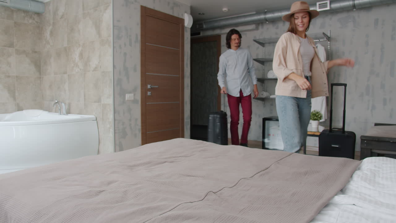 Couple Arriving at Hotel Room