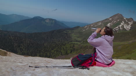 woman hiking on a mountain summit
