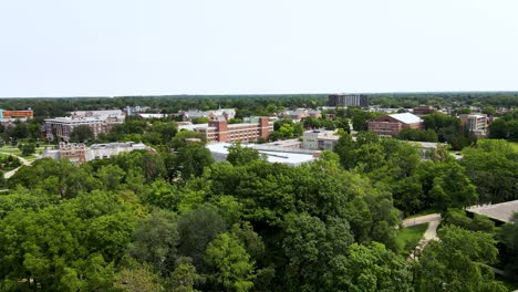 panning left in the air over the central area of michigan state's campus