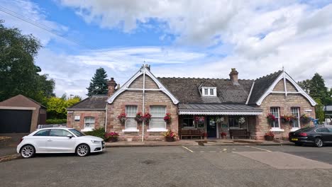 vehicles park outside a charming scottish restaurant