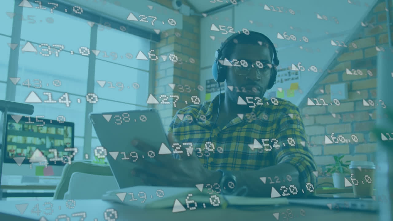 Animation of businessman using a digital tablet wearing headphones 
