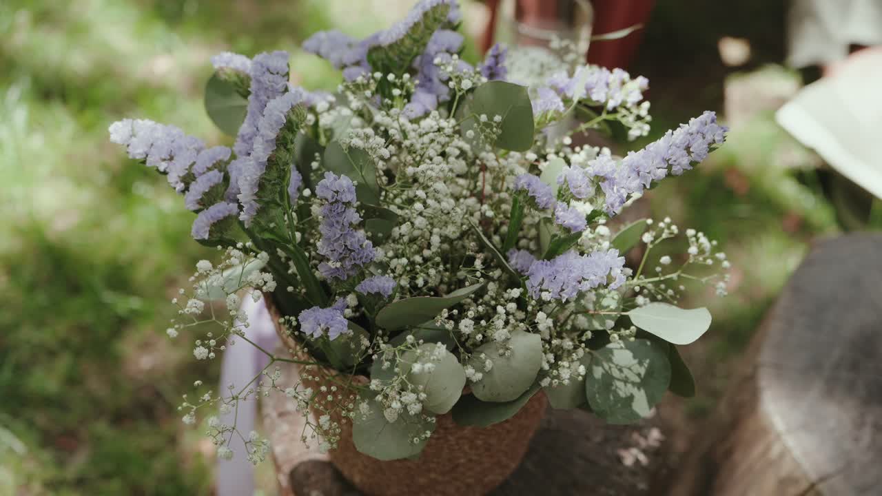 soft flowers bloom in natural light arranged in simple earthy vase