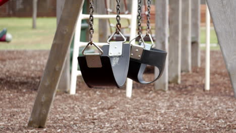 empty swing set in an empty playground