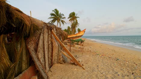 Moree-Ghana-Africa-established-of-traditional-fisherman-house-on-tropical-sandy-beach-inside-an-african-fishing-village