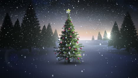 Snow-falling-on-christmas-tree-in-snowy-landscape