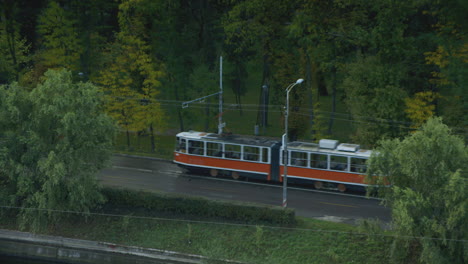 a tram trundles through the frame in cluj napoca, romania