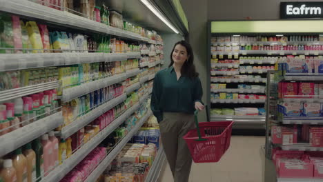 woman shopping in a supermarket aisle