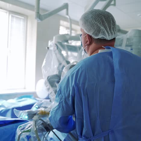 surgeon operating with a robotic surgical system in an operating room
