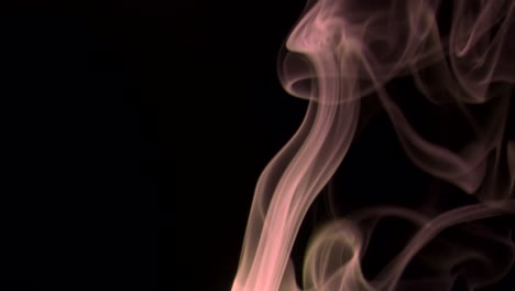 red- brown smoke rising graceful twists upward. colored smoke blowing from bottom to top. close-up, isolated on black background