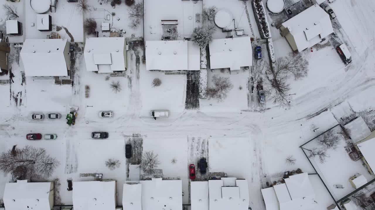 Top down drone shot of cityscape with snow in winter in Saint-Constant, Quebec, Canada