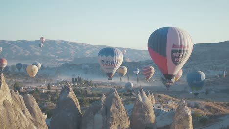 hot air balloons over fairy chimneys goreme, cappadocia