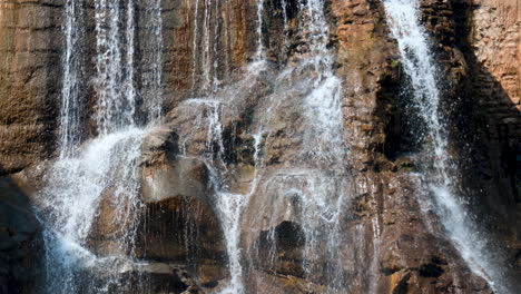 waterfall cascade through the rocky trails in the forest