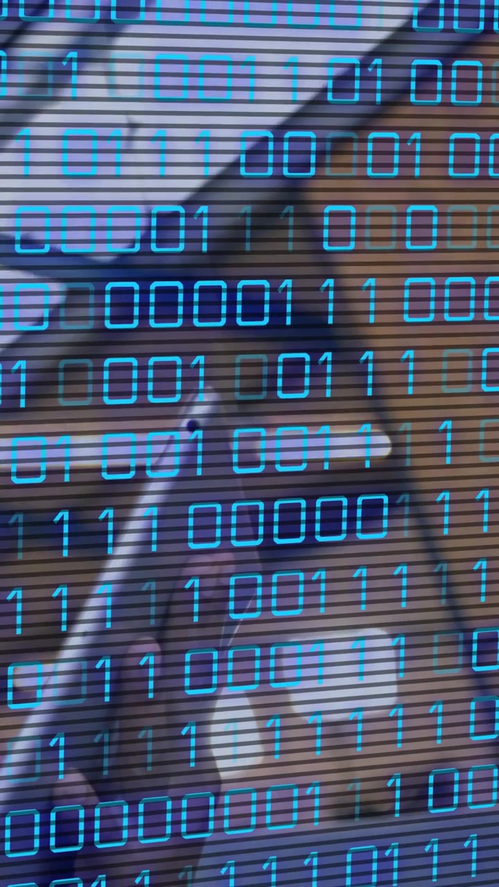 Vertical video: Woman in car reacting to binary overlay appearing, adjusting visor for tech demo