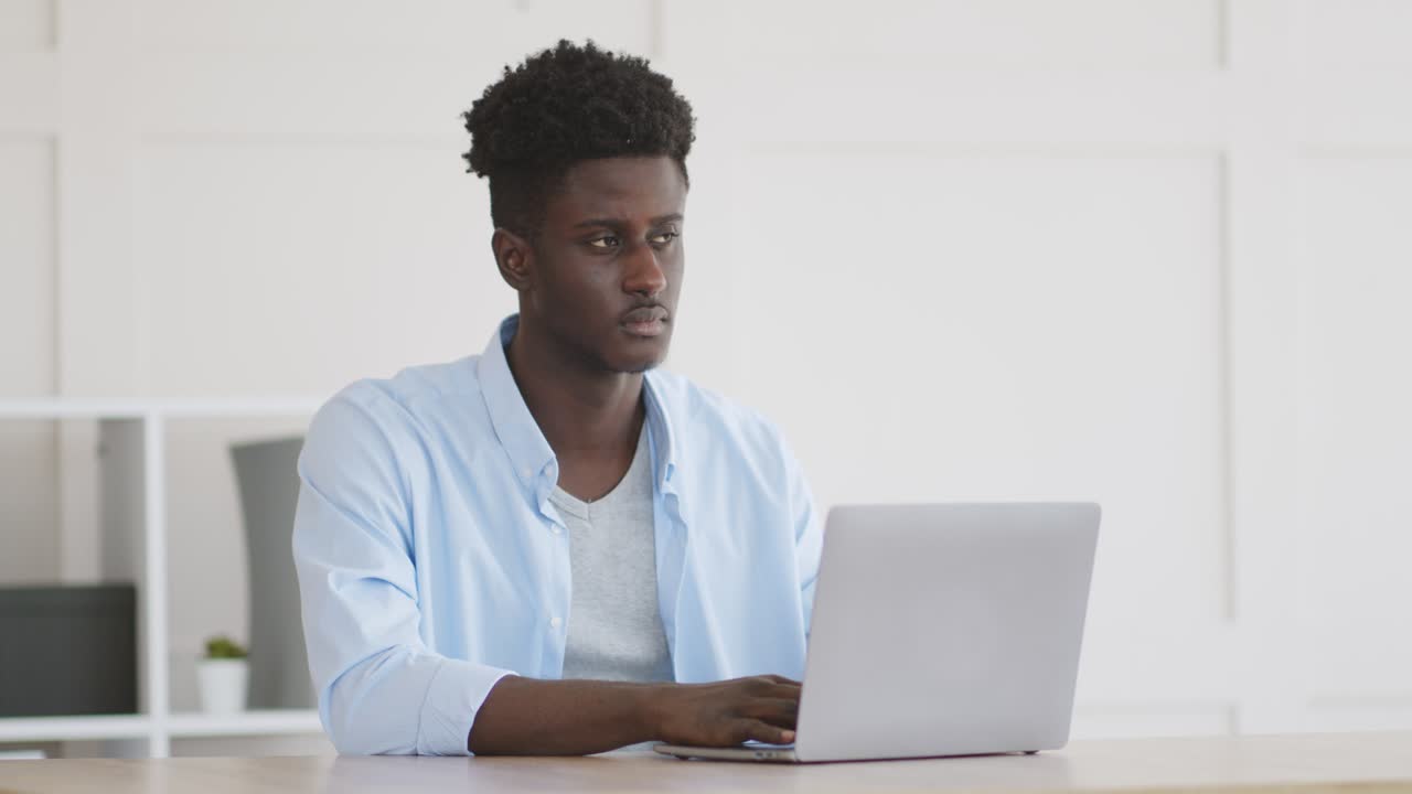 Man Working on Laptop in Office