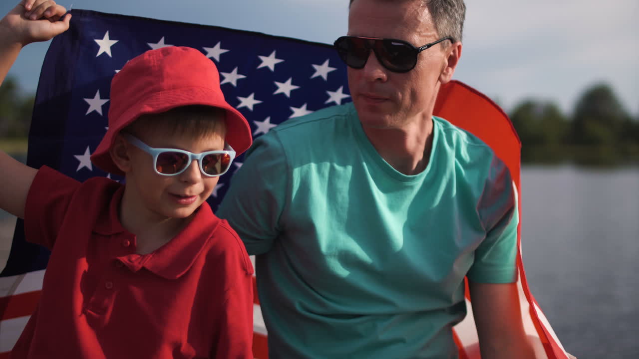 Father and Son Celebrate with American Flag