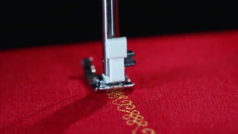 pattern sewing needle in slow motion stitching. close up sewing needle stitching