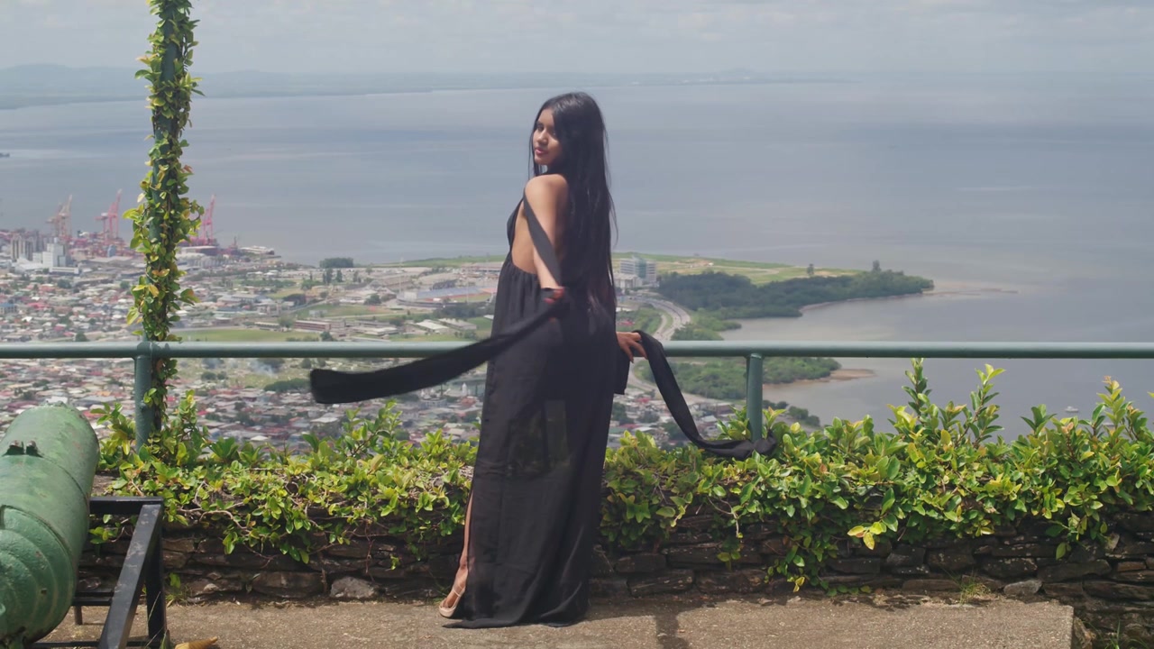 Dynamic Drone-Style High Angle View: Indian Girl on Fort Citadel Over City
