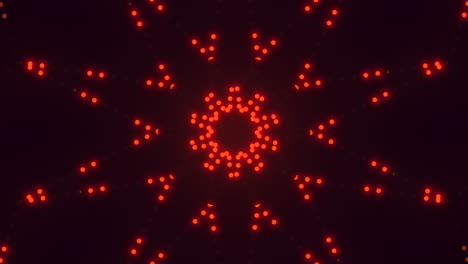 el círculo de puntos rojos radiantes brilla en un patrón simétrico