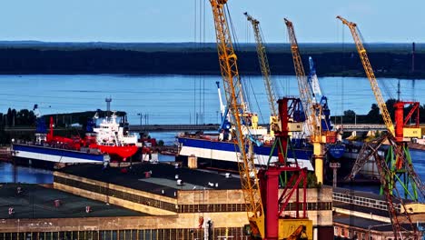 shipyard industrial repair yard marina port riga latvia baltic sea crane, aerial drone