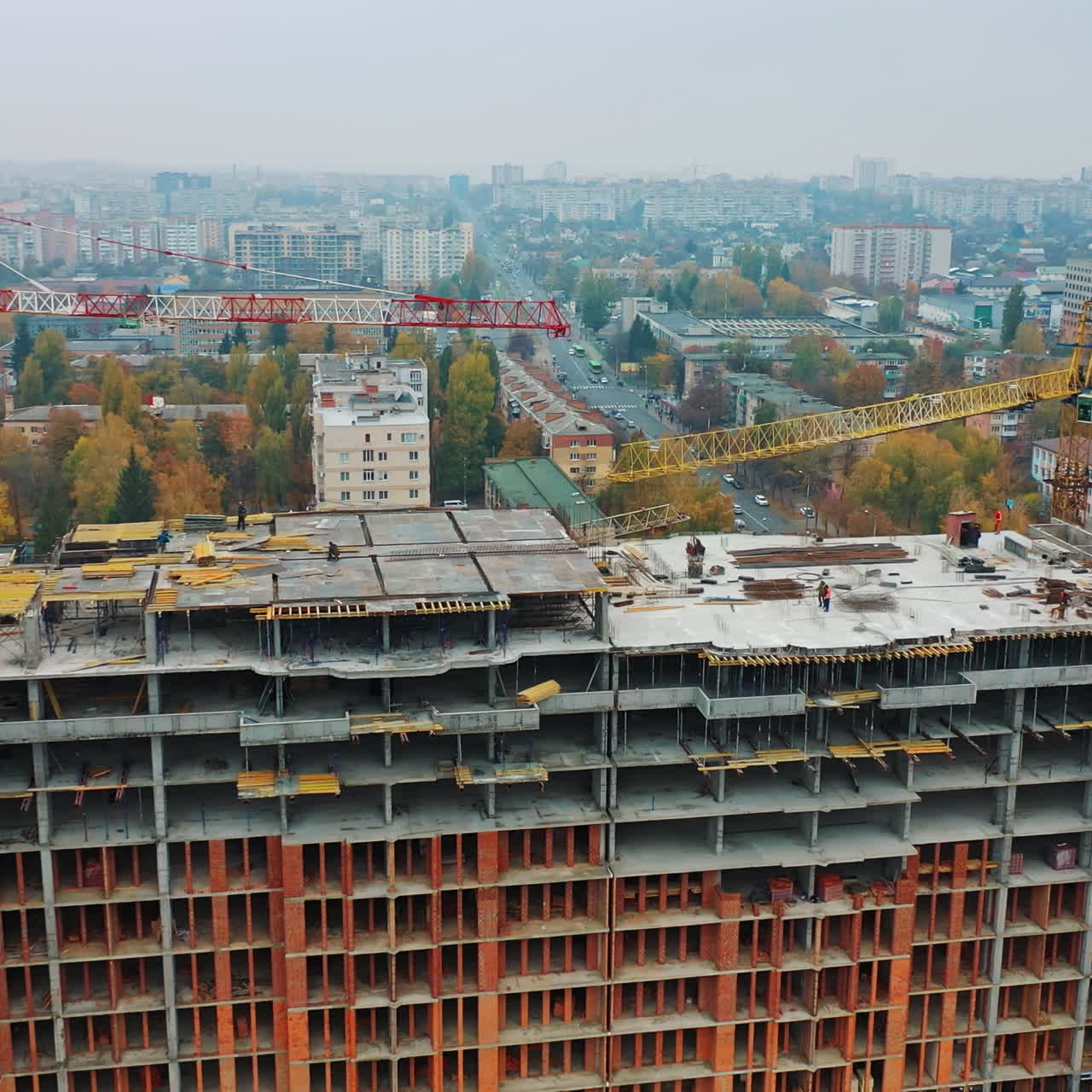 Construction site of modern multi-storey building in the city. Aerial panoramic view on a construction of a new building.