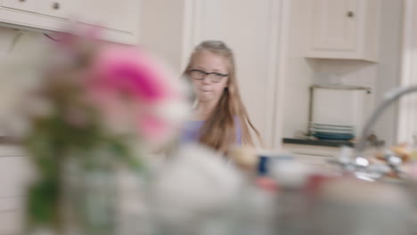 happy-ballerina-girl-dancing-in-kitchen-having-fun-practicing-ballet-dance-moves-wearing-purple-tutu-at-home