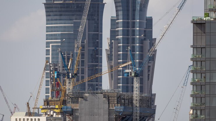Time Lapse of Cranes Working on a Modern City Construction Site