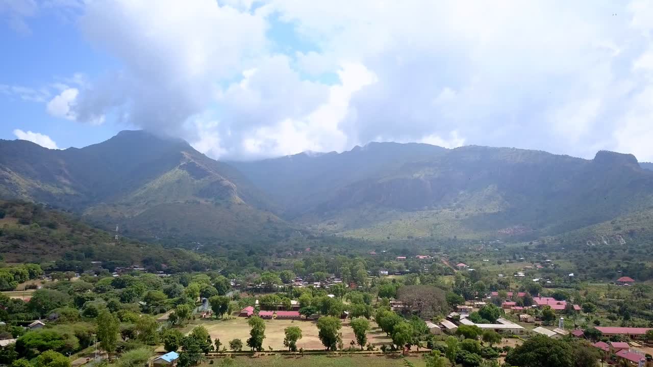 Moroto Town With Mount Moroto Towering in the Background in Uganda, Africa - Drone Flying Forward