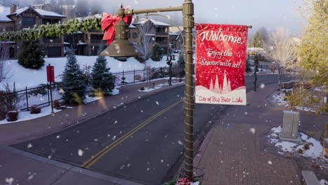 christmas decorations on street light in small idyllic snowy winter town
