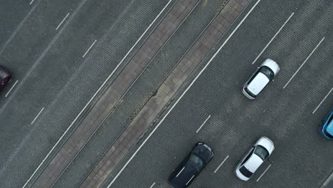 aerial view of city street intersection with cars and tram tracks