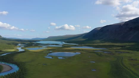 Drone-shot-of-Sweden-wilderness-in-summer-in-Scandinavia-with-cloudy-sky