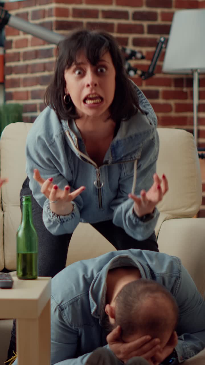 Couple Reacting to Shocking News While Watching TV