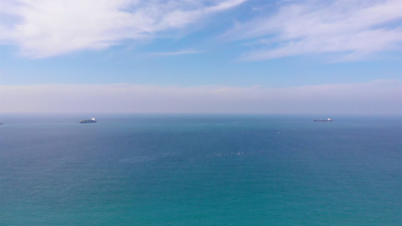 Two Cargo ships in the Distance of Mediterranean sea, Aerial