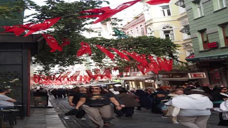 crowded street in istanbul with turkish flags