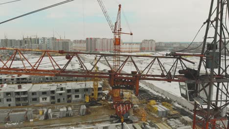 large-rusty-construction-crane-pillar-on-undone-building