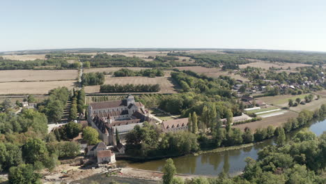 Aerial-drone-point-of-view-of-the-beautiful-Abbaye-de-Fontgombault-or-Abbey-of-Notre-Dame