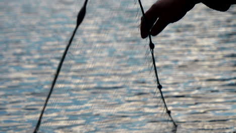 Close-up-shot-of-fishing-net-in-calm-water