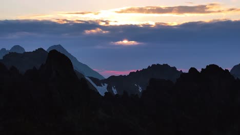 mountain landscape dynamic slow stable drone shot at sunrise in alpine environment and sharp ridges 1