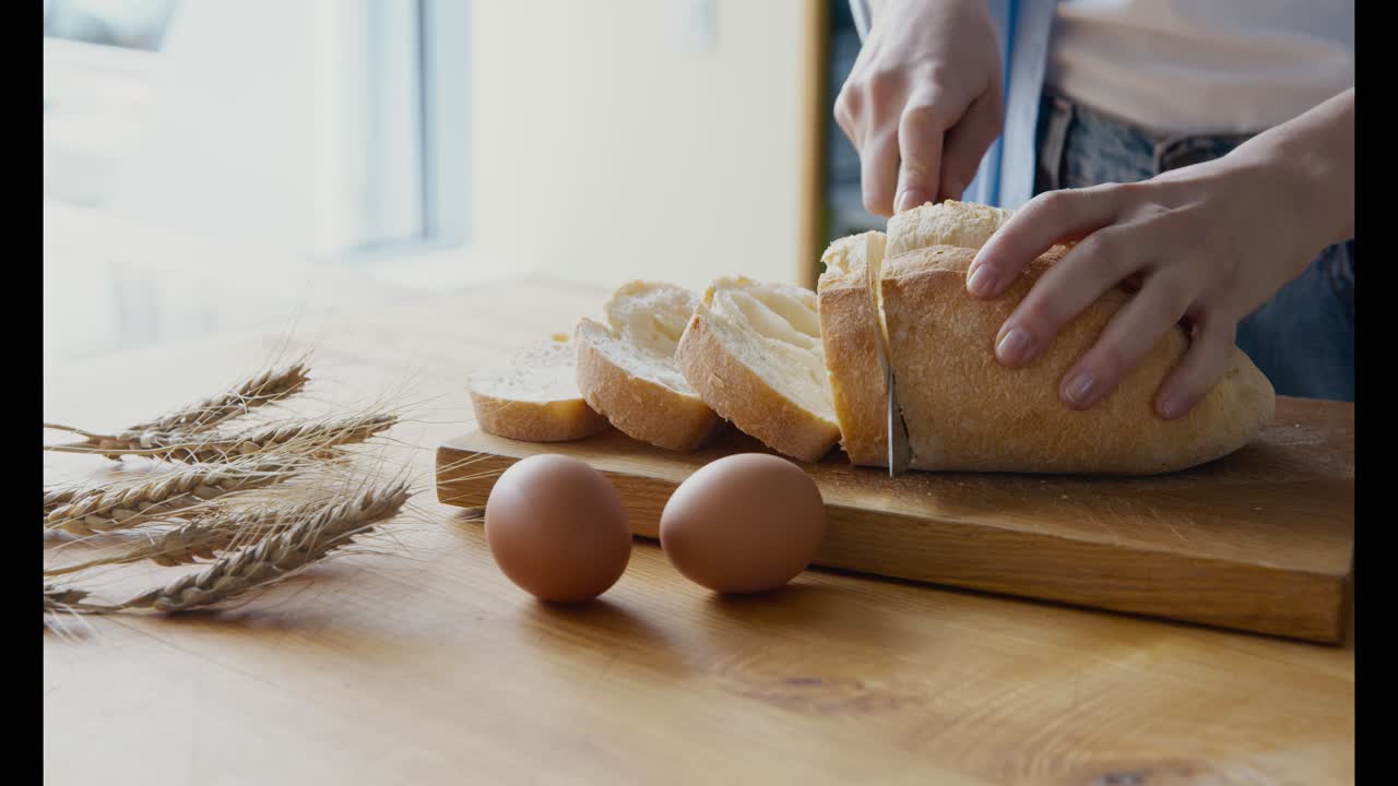 Slicing Bread with Eggs on Wooden Table