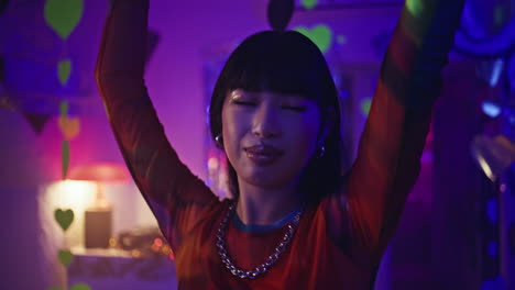 student dancing neon lights nightclub closeup. trendy woman moving body