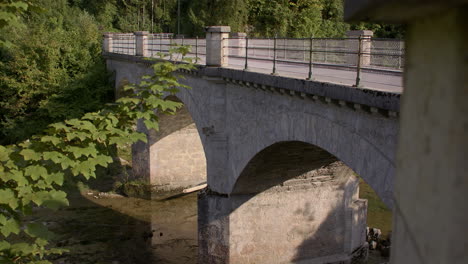 historic stone bridge over a picturesque river, evening sun, water reflection