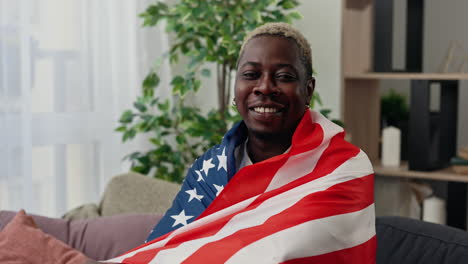 man wrapped in american flag