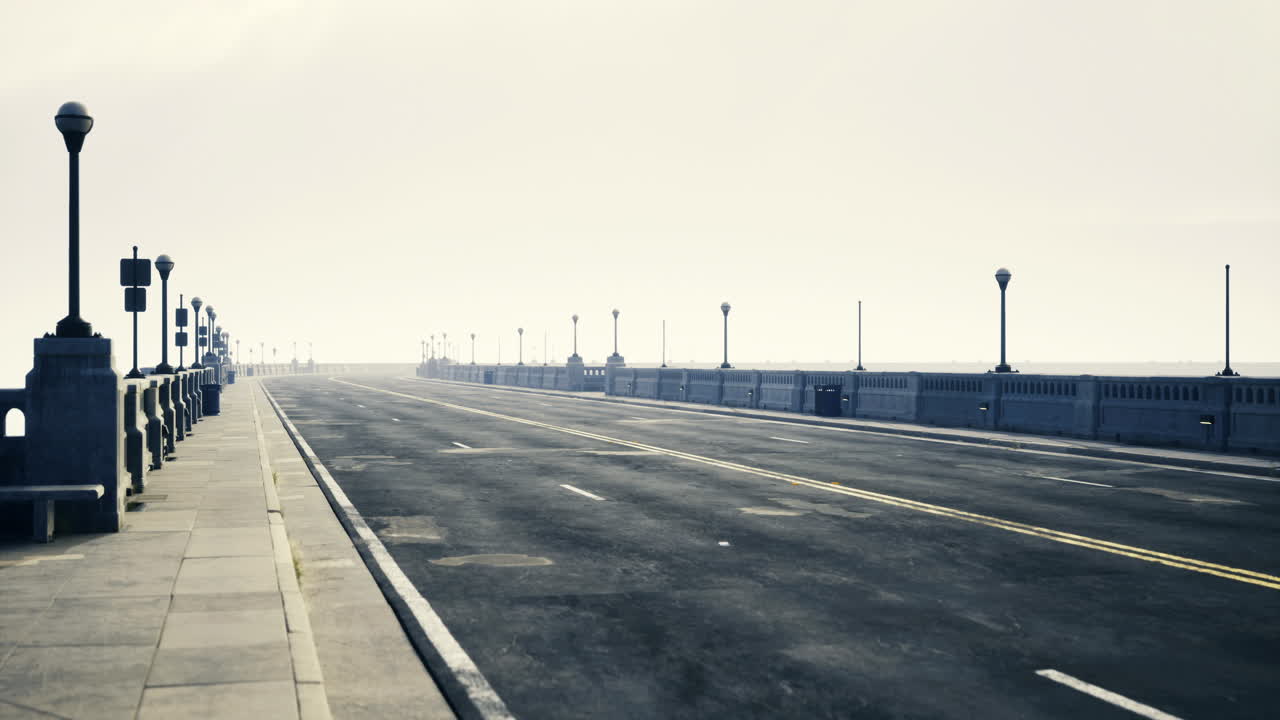 Wide empty road on a seaside promenade during overcast weather