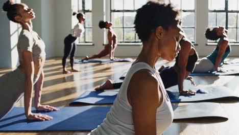 group of women practicing yoga